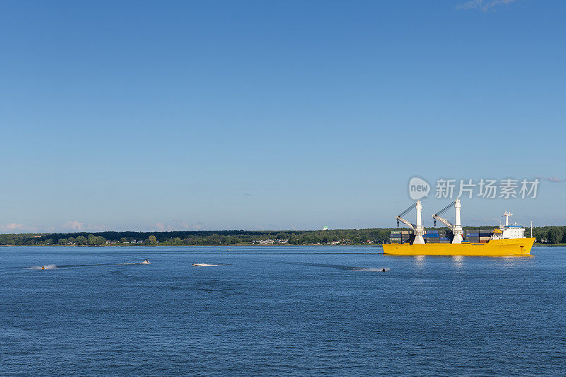 container ship and some jet skis at Trois-Rivieres in Canada